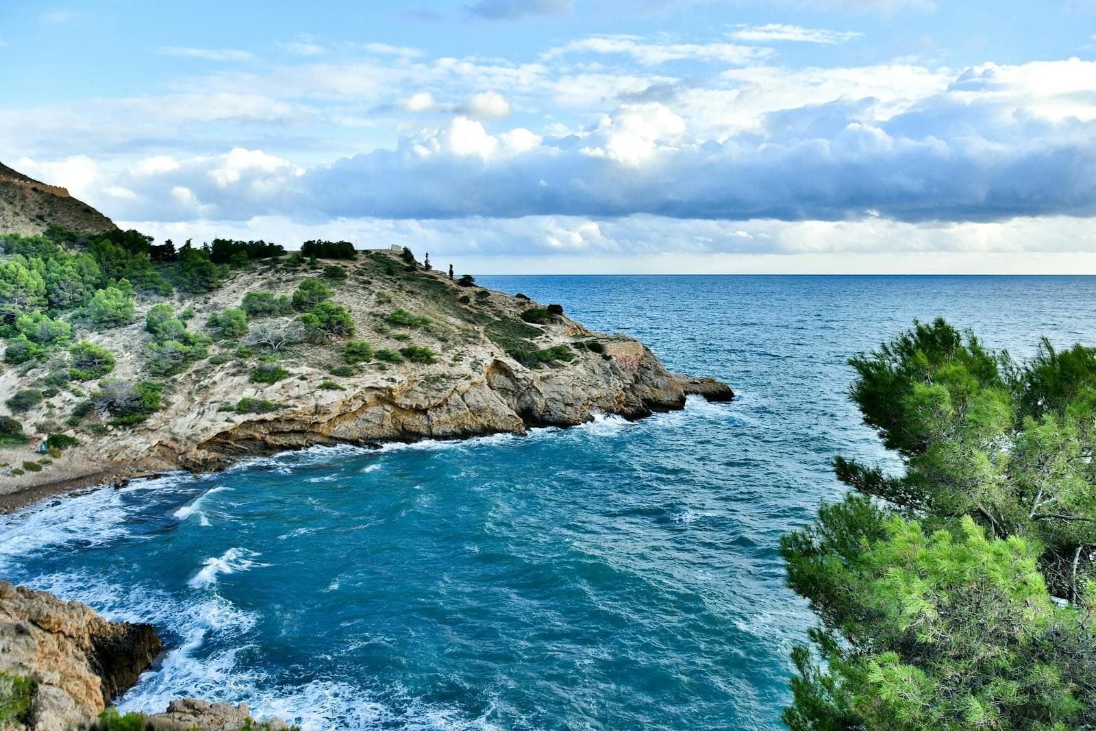 Costa Brava wedding venue at golden hour with guests seated for dinner before dancing