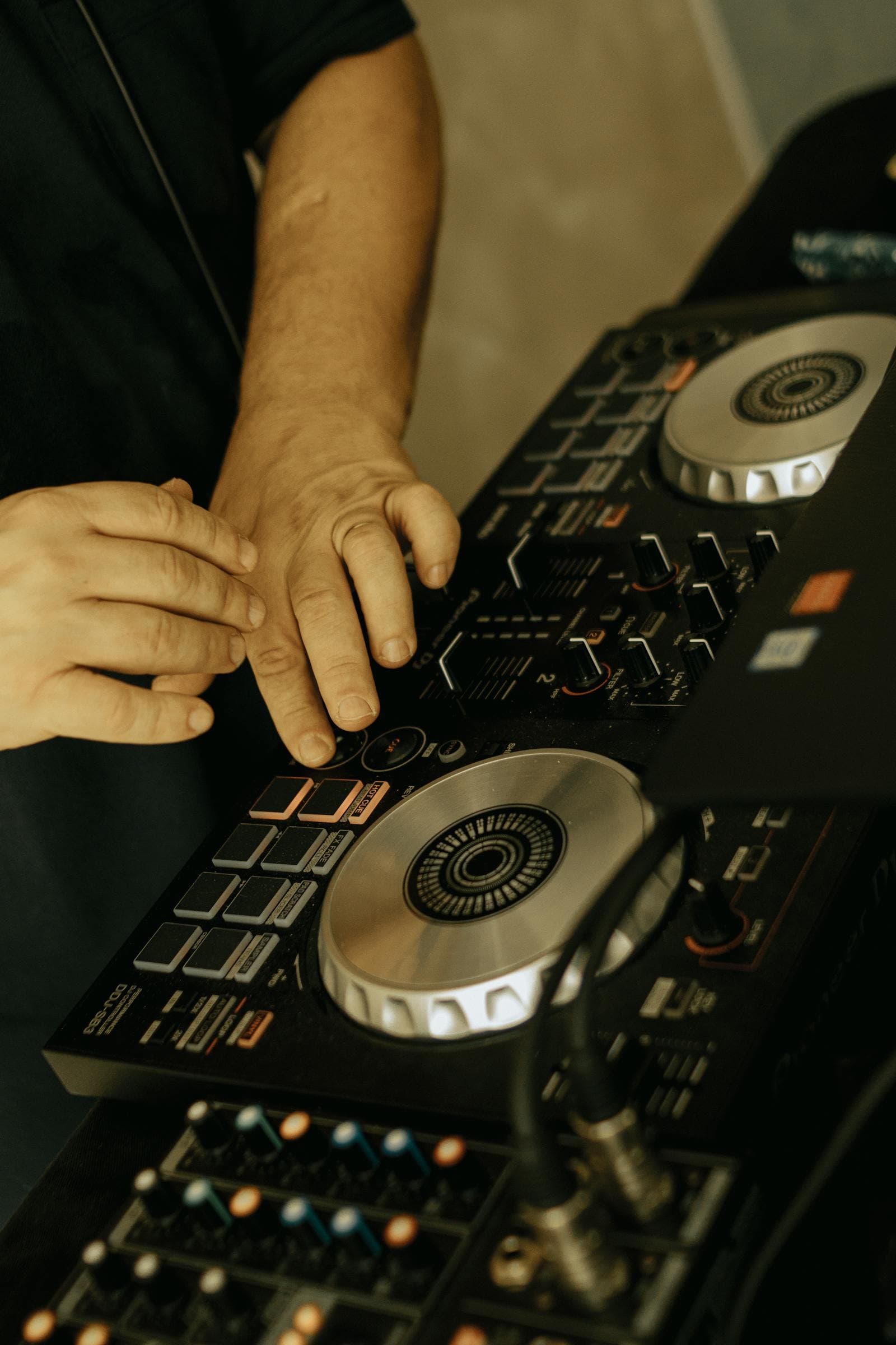 Wedding DJ booth at a destination wedding in Spain with the band setting up behind