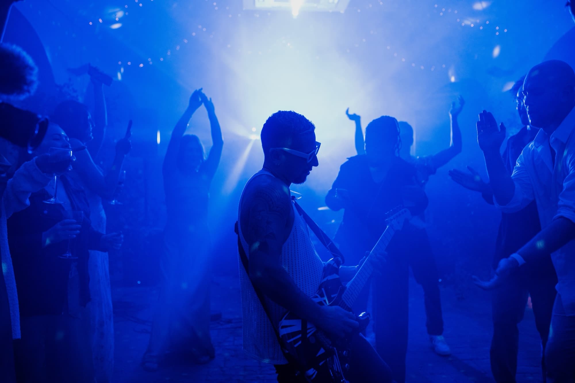 Sax player with a DJ at a Mediterranean villa wedding peak dancing hour