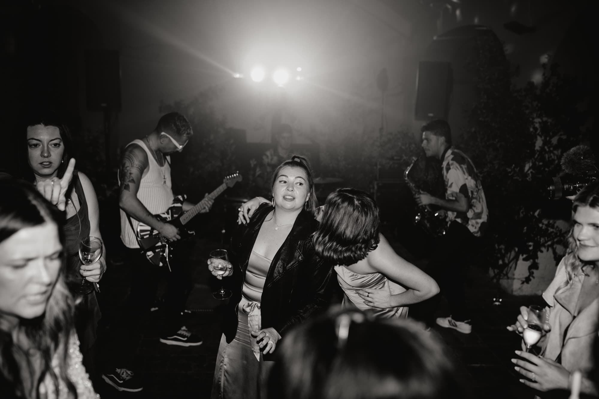 Long dinner tables under olive trees at a Mediterranean destination wedding venue in Spain